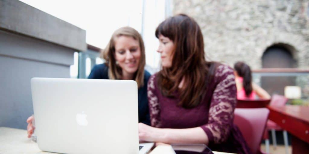 Photo of Natalie Coooke, ncco founder, working with a client on a laptop
